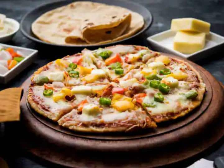 Sooji Pizza Recipe: मैदा से बने Pizza खाने का मन नहीं है तो घर पर बनाएं सूजी का बना पिज्जा